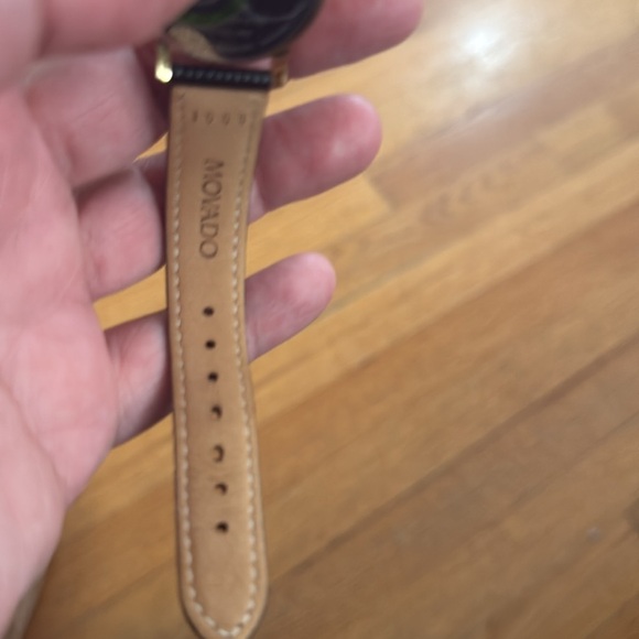 Movado Woman’s  Black and Gold Watch Swiss leather